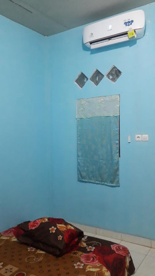 Penginapan Asidik Bira Buitenkant foto