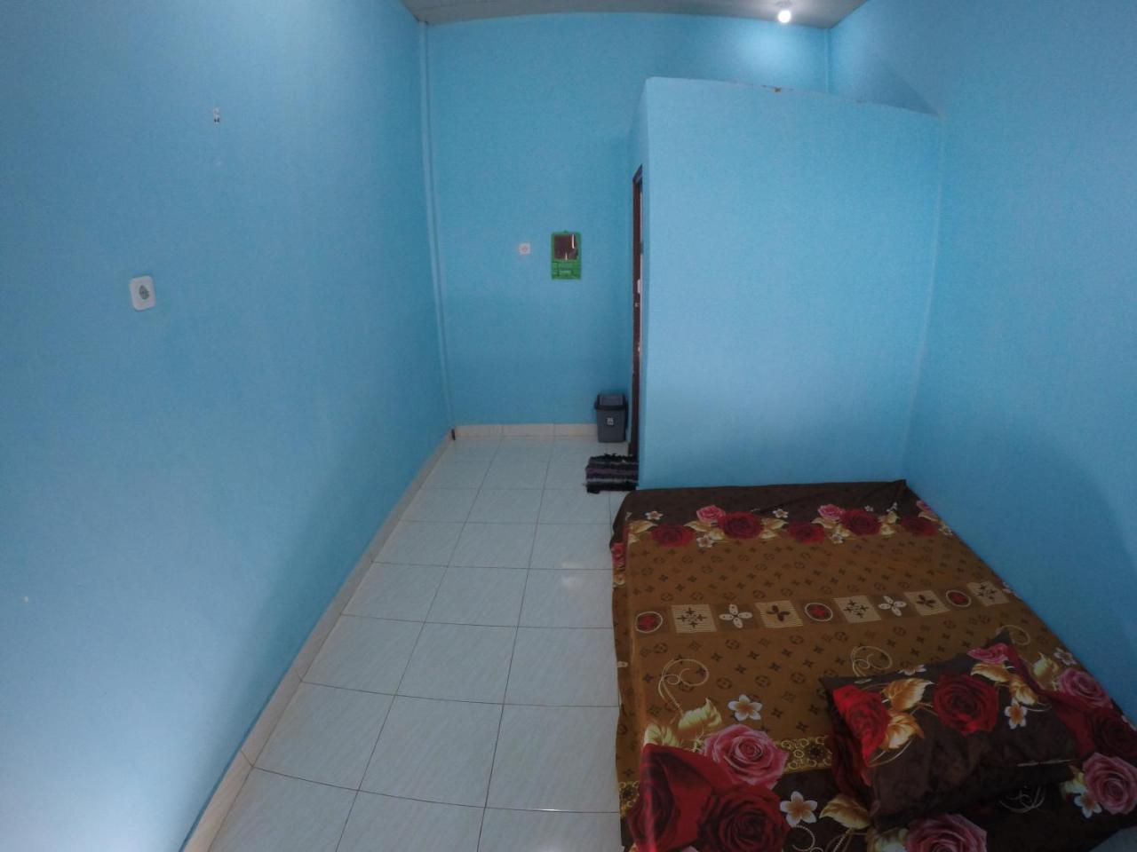 Penginapan Asidik Bira Buitenkant foto